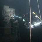 Diver on line with several tanks